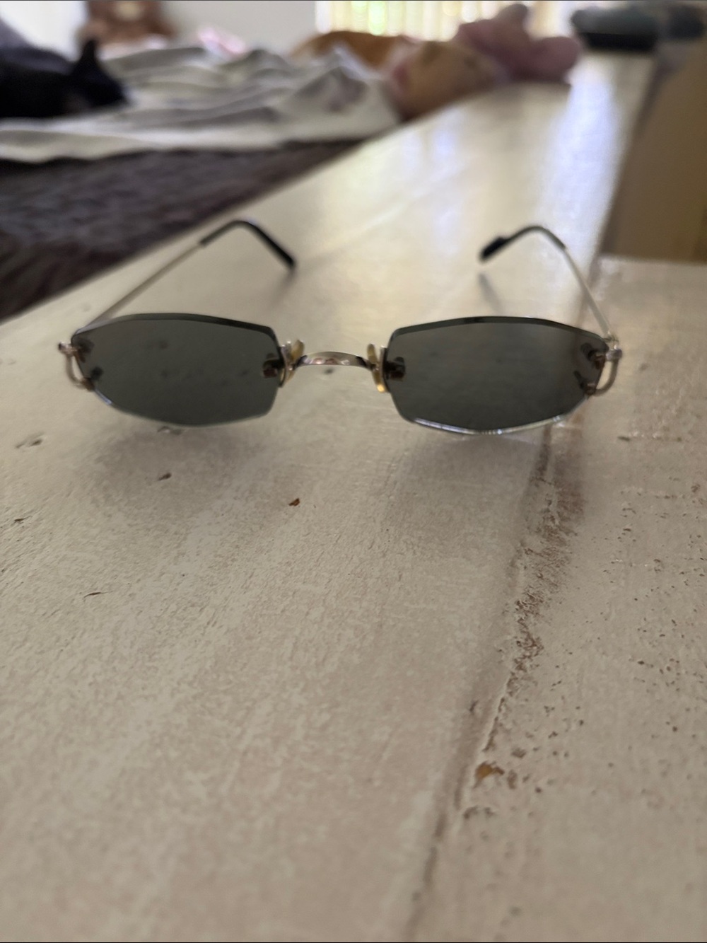 Cartier Rimless Sunglasses with Dark Gray Lenses and Gold Accents